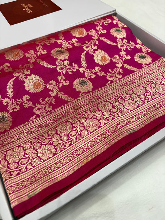 Decorative fabric with intricate gold patterns on a red background