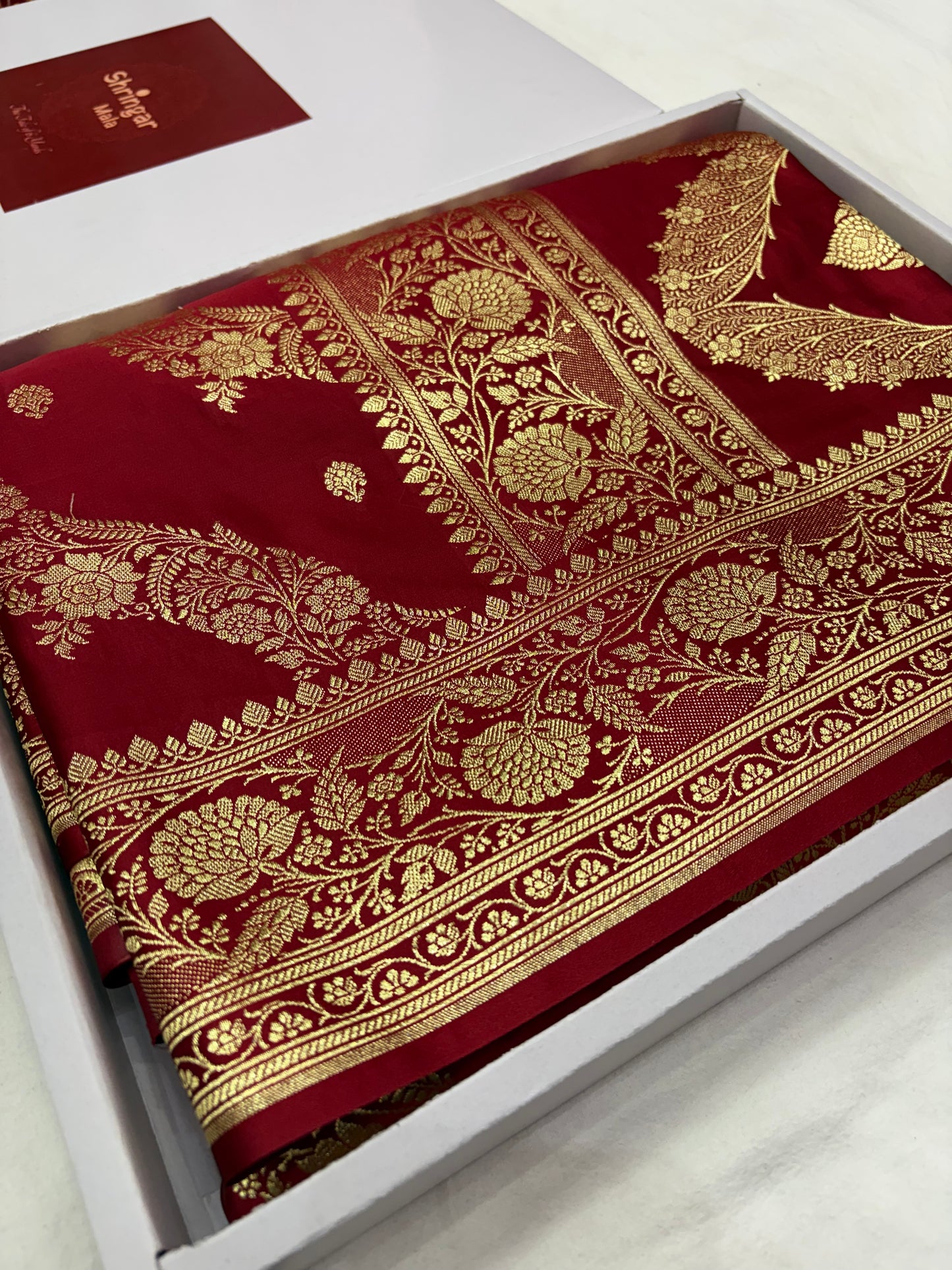 Adaa – Deep Maroon Katan Banarasi Silk Saree with Gold Zari Leheriya Weaving