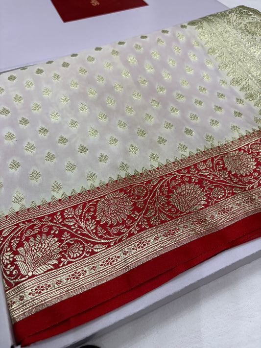 Ivory Katan Banarasi Saree with Red Contrast Border and Ornamental Pallu
