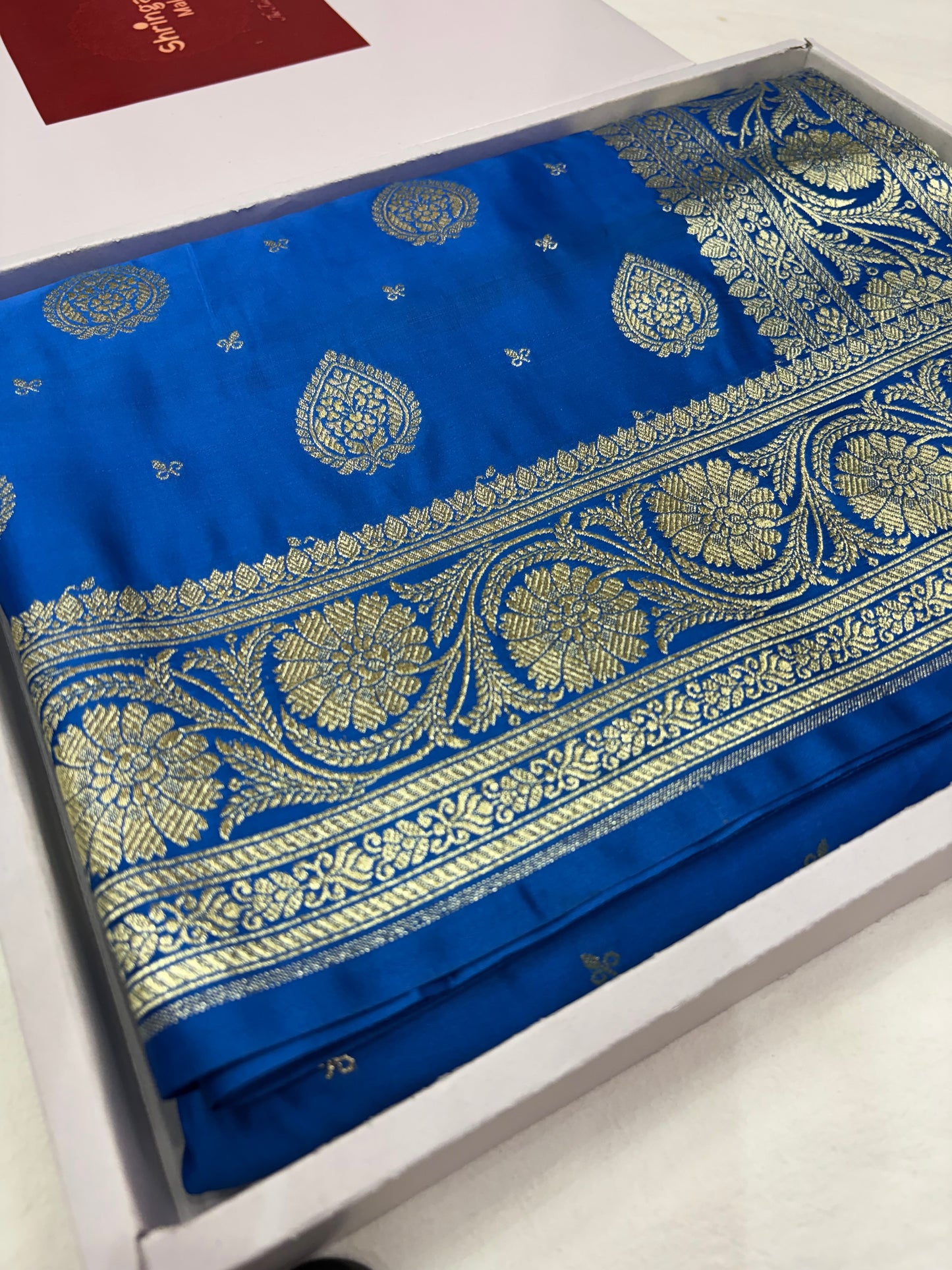 Peacock Blue Katan Banarasi Saree with Paisley Buti and Ornamental Pallu