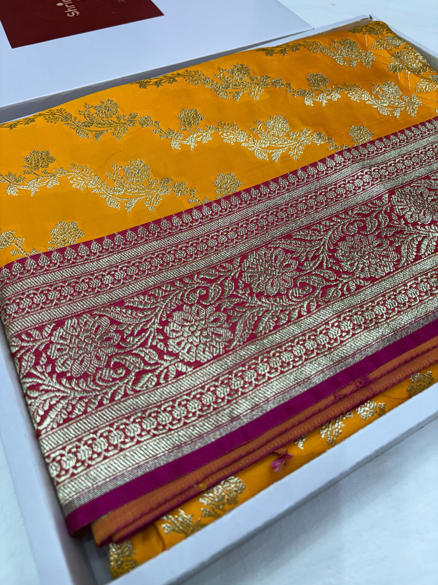 Mustard Yellow Katan Banarasi Saree with Rani Pink Contrast Border and Floral Jaal