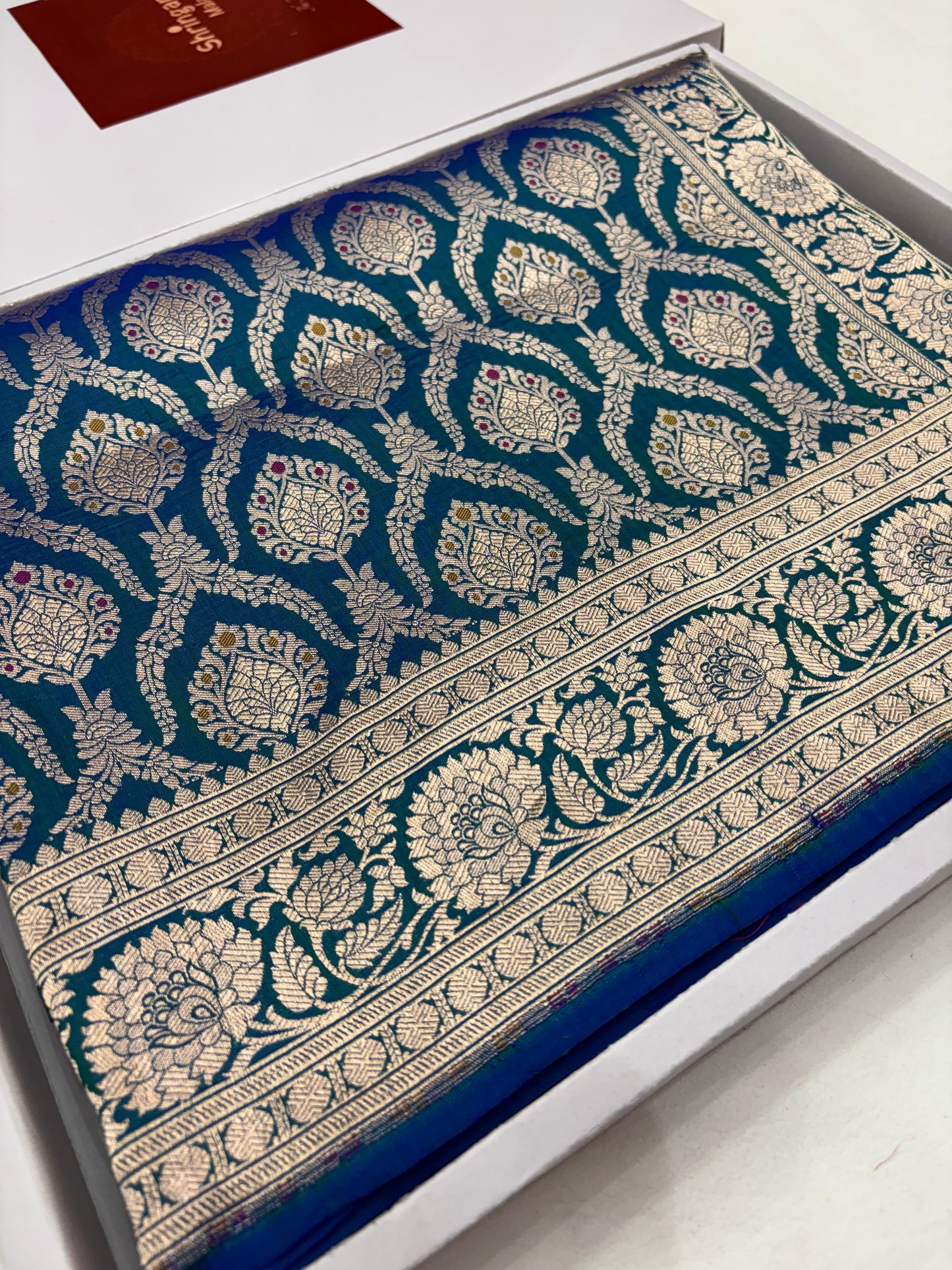 Decorative fabric with intricate patterns on a white background